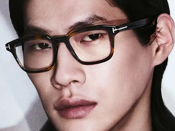 Designer Glasses Collection featuring luxury brands like Tom Ford, Ray-Ban, and Gucci